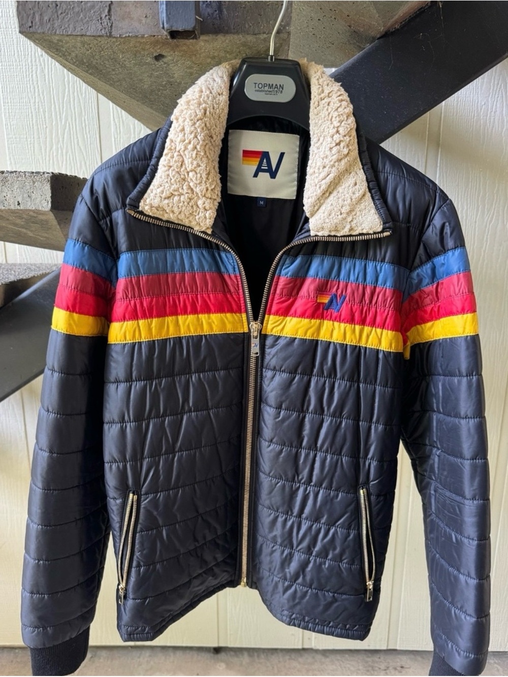Aviator Nation Black Puffer Jacket with Blue, Red & Yellow Stripes